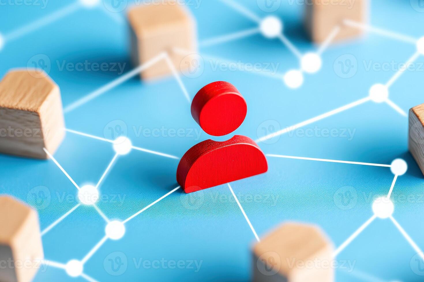 A red figure representing a person stands out in a network of wooden blocks on a blue background, symbolizing connection and community. photo