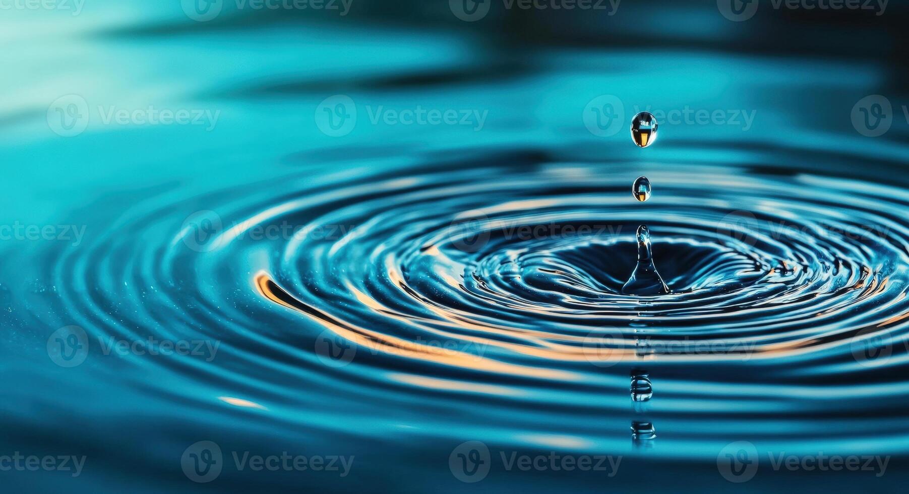 A vivid close-up of a water droplet creating ripples on a serene surface, capturing the beauty of nature's fluid motion. photo