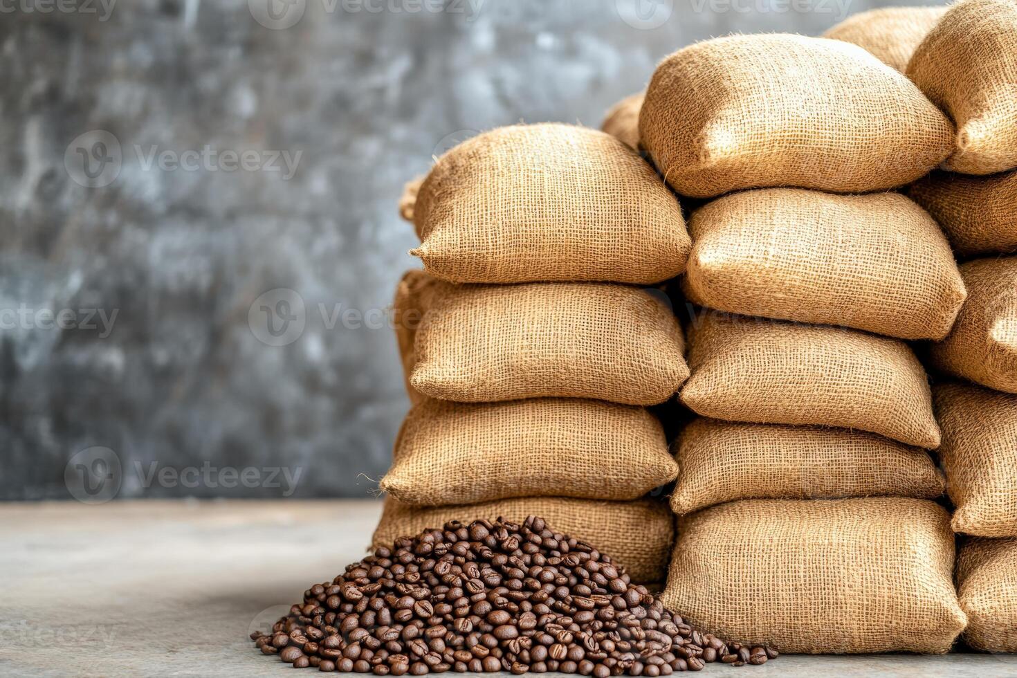 A stack of burlap sacks filled with fresh coffee beans on a textured background, ideal for food and beverage themes. photo