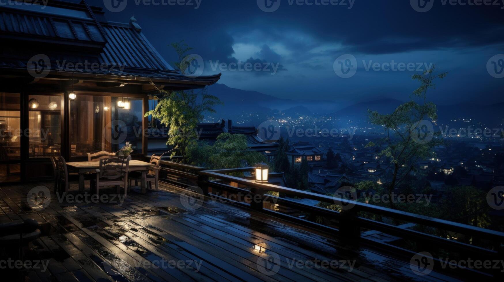 Wet wooden balcony with a view of a city at night. photo