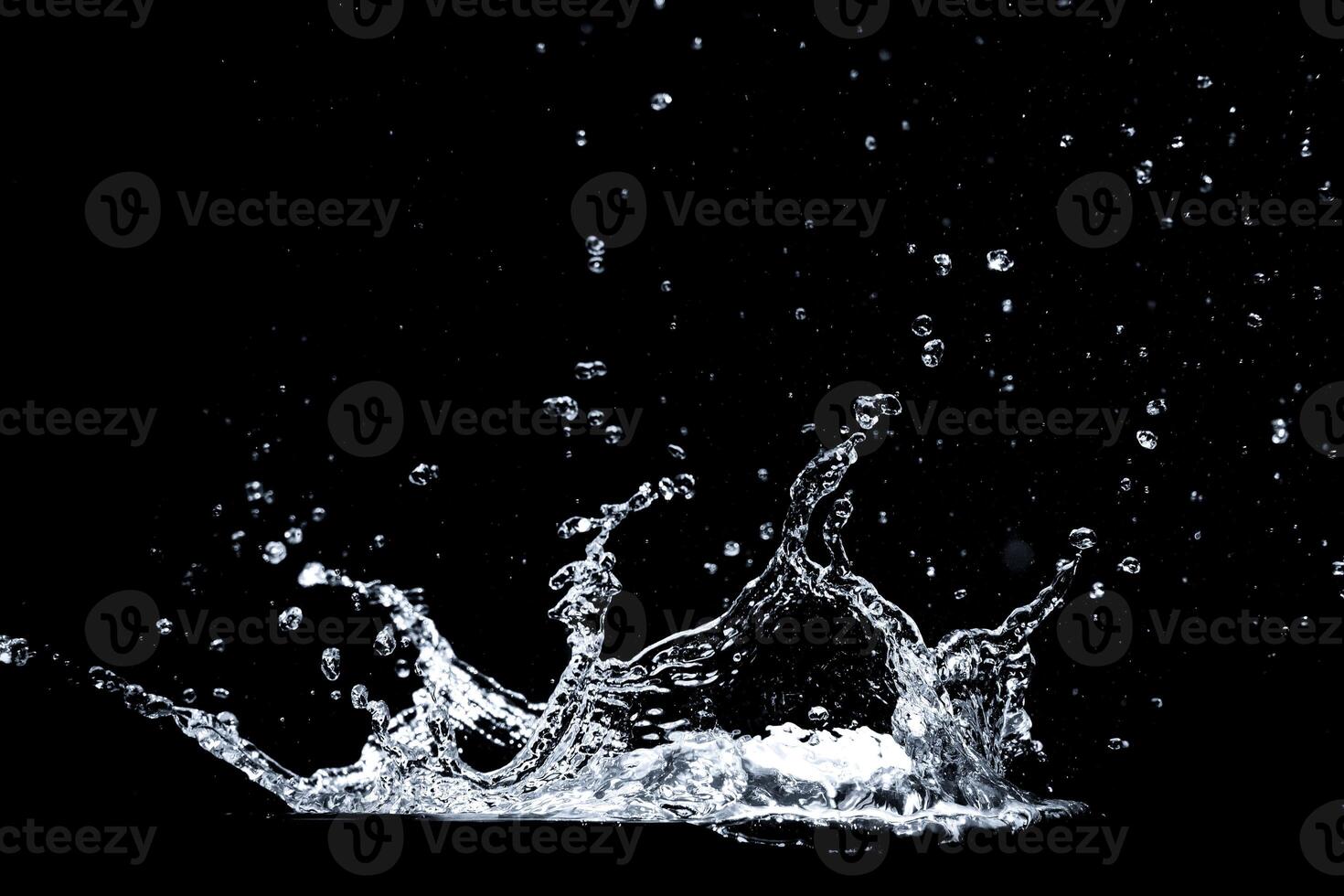 Splashing Water Droplets on Black Background Captured in High-Speed Photography photo