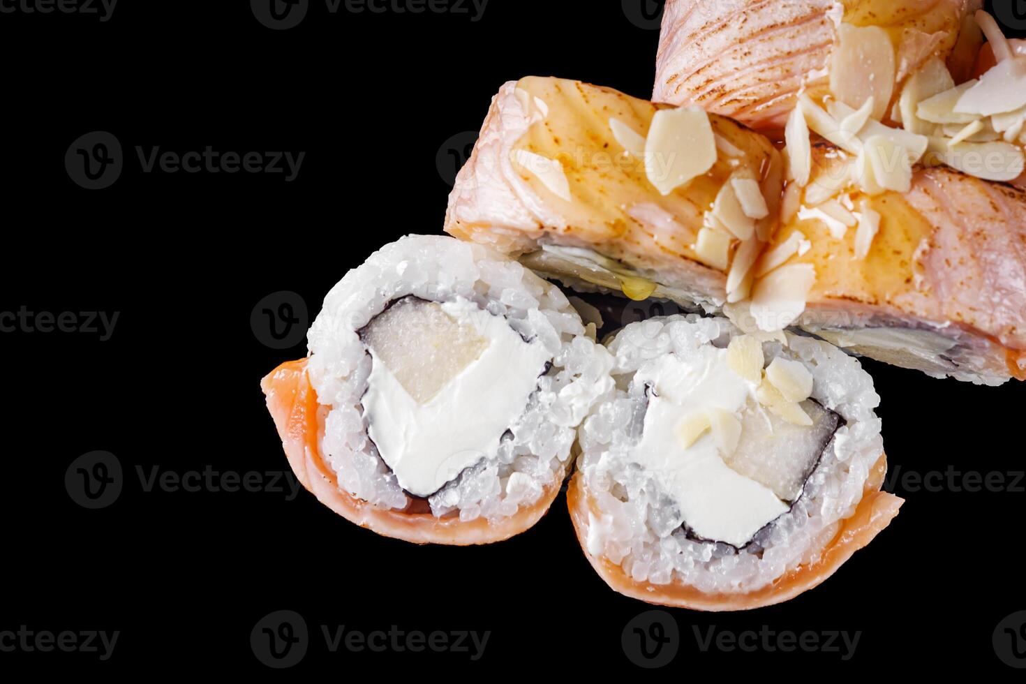 sushi roll with cream cheese tofu salmon on a black mirror background photo
