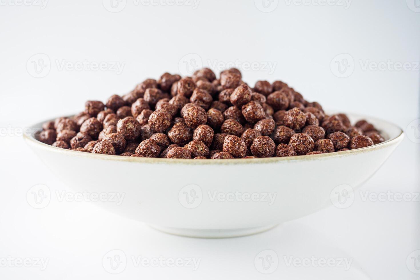 sweet crunchy chocolate children's breakfast chocolate balls on a white background photo
