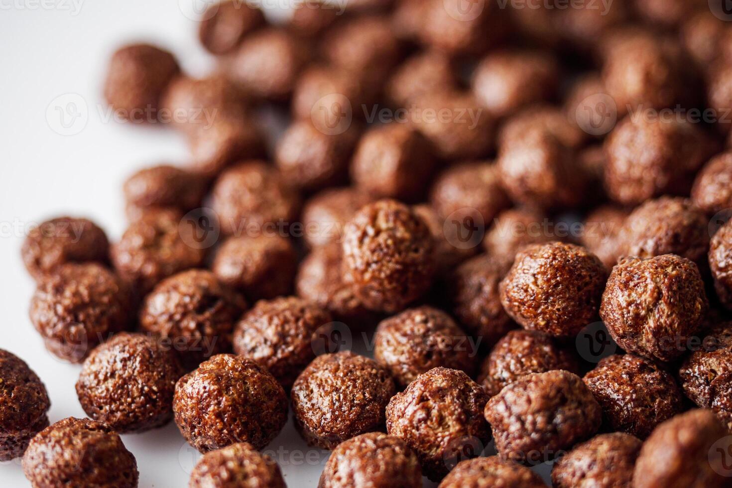 sweet crunchy chocolate children's breakfast chocolate balls on a white background photo
