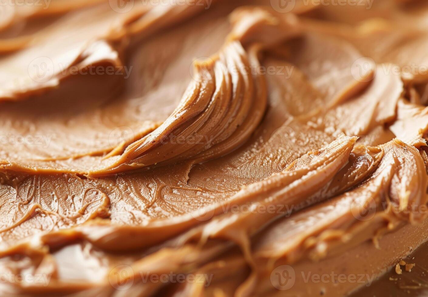 High-detail close-up of the smooth and creamy texture of peanut butter photo