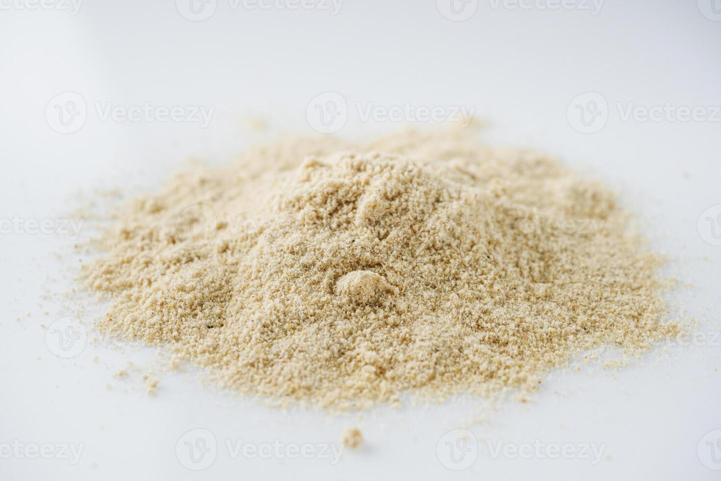 asafoetida aromatic powder on a white acrylic background photo