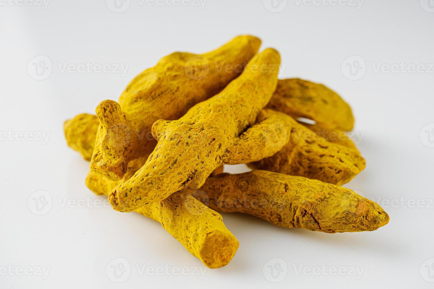 aromatic turmeric root on a white acrylic background photo