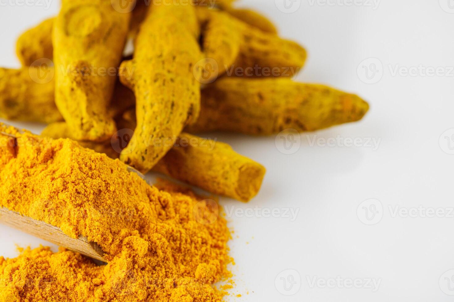 aromatic turmeric root on a white acrylic background photo