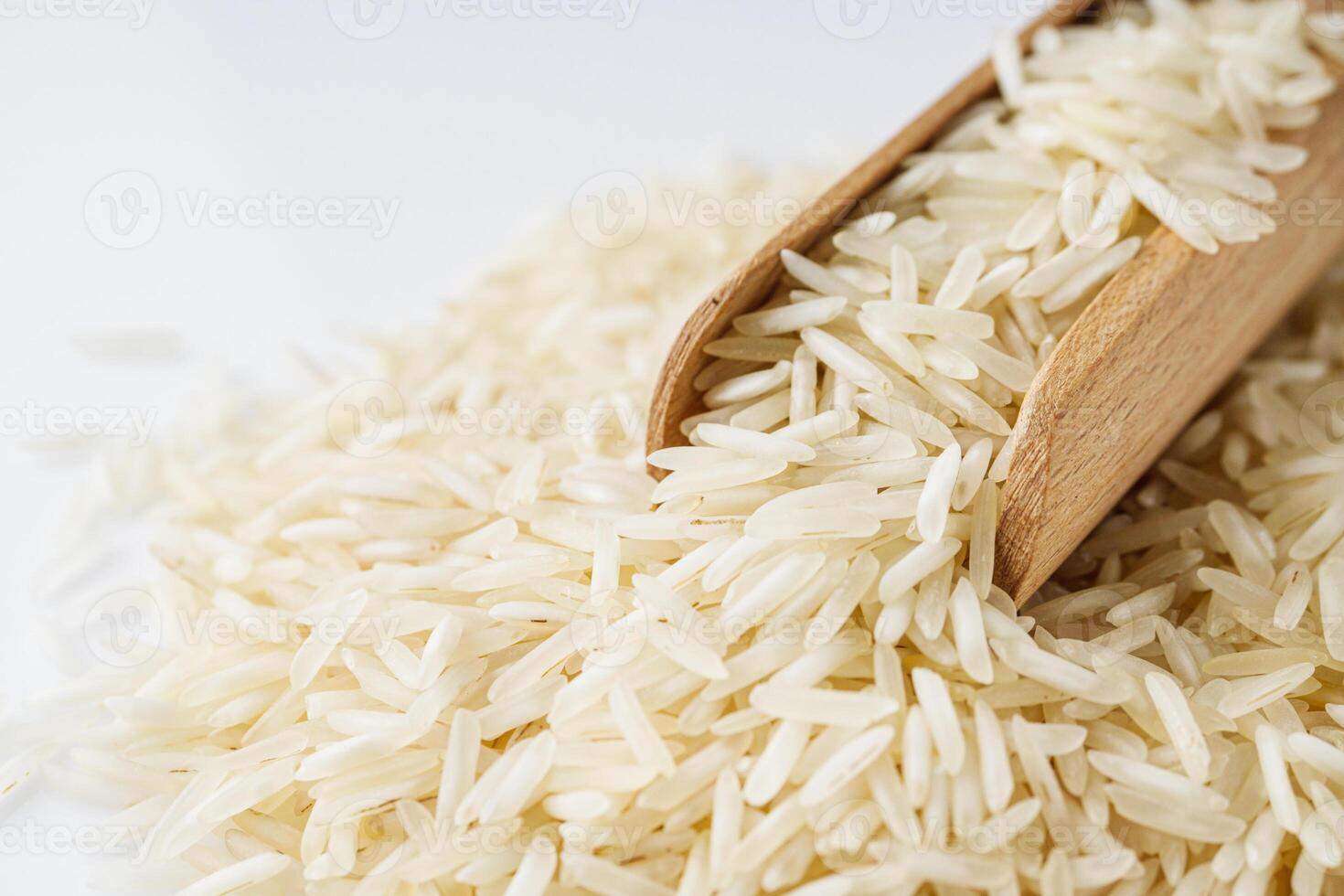 raw basmati rice on a white acrylic background photo