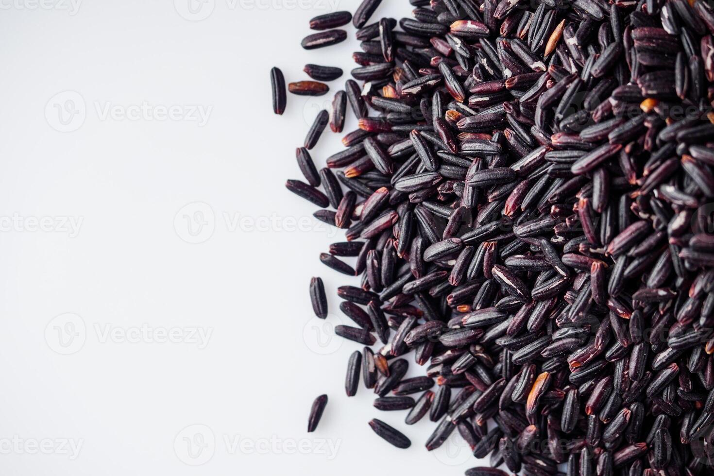 raw fresh black rice on a white background photo