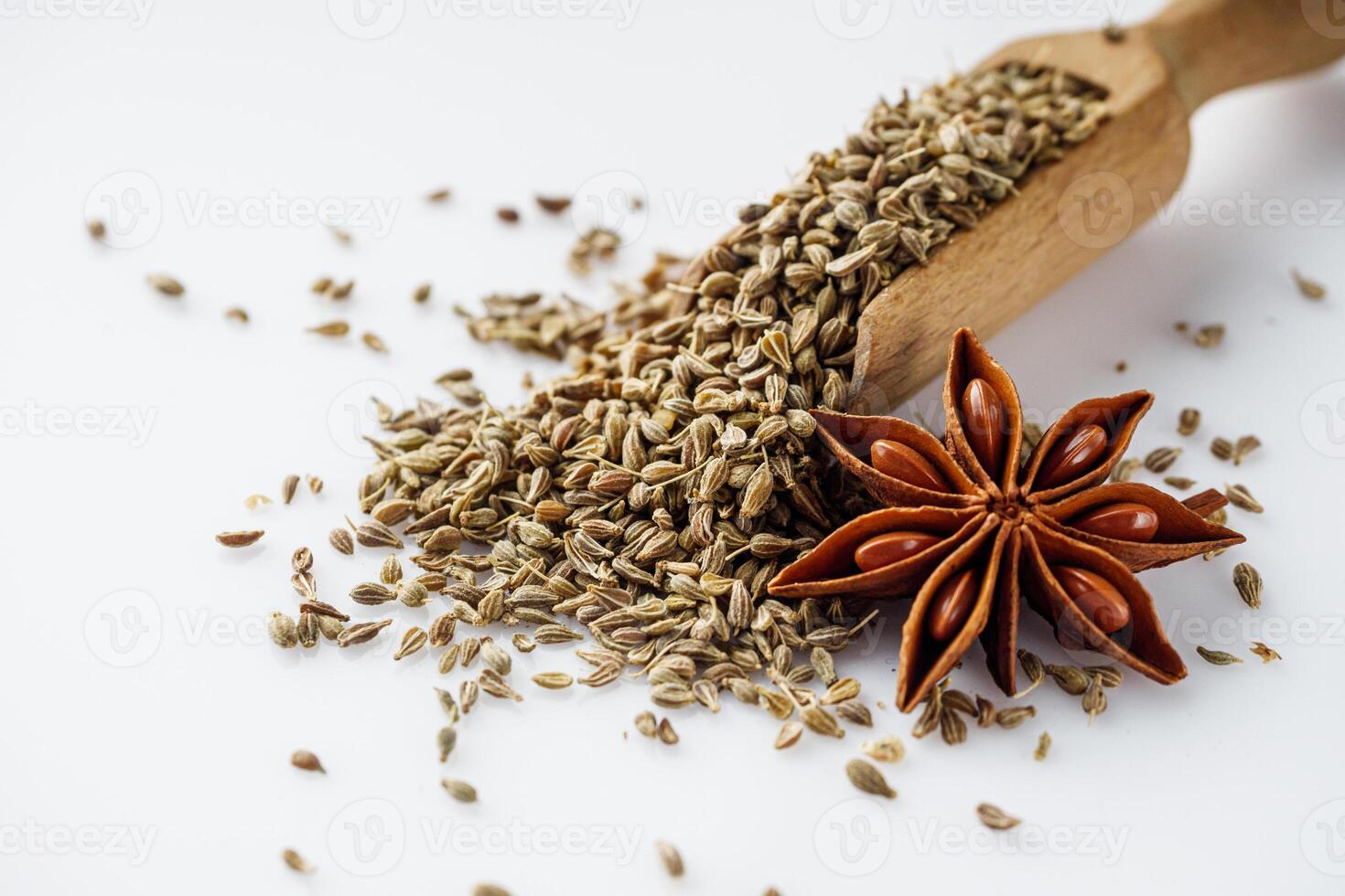 aromatic dry anise seeds on a white background photo