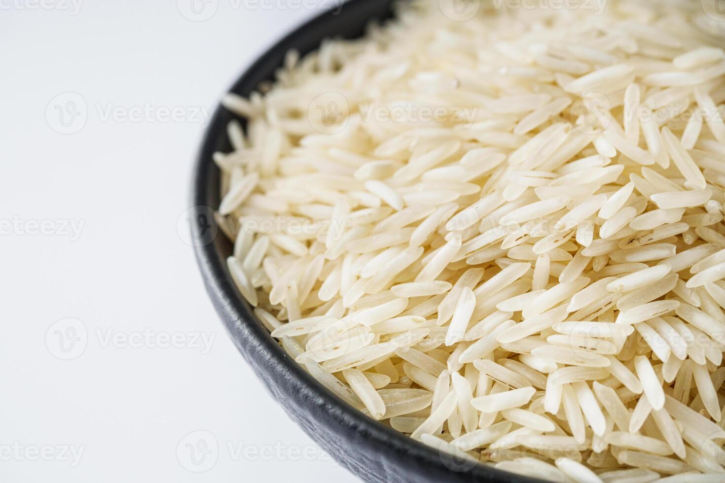 raw basmati rice on a white acrylic background photo