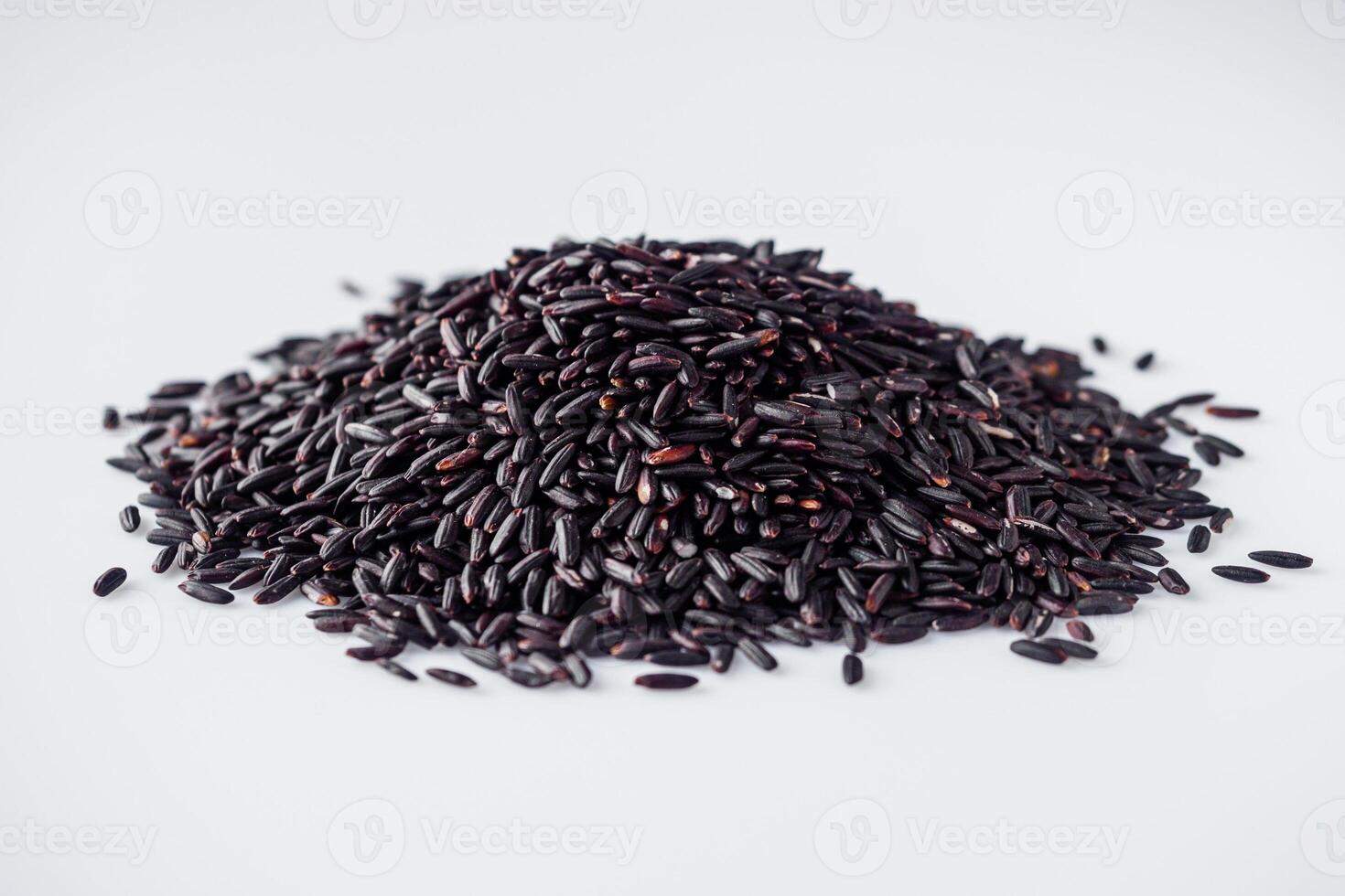 raw fresh black rice on a white background photo