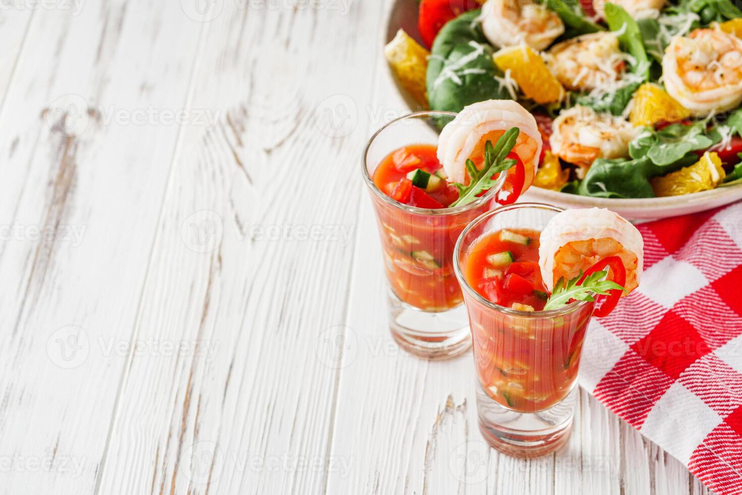 delicious summer gazpacho cocktail on a white wooden rustic background photo