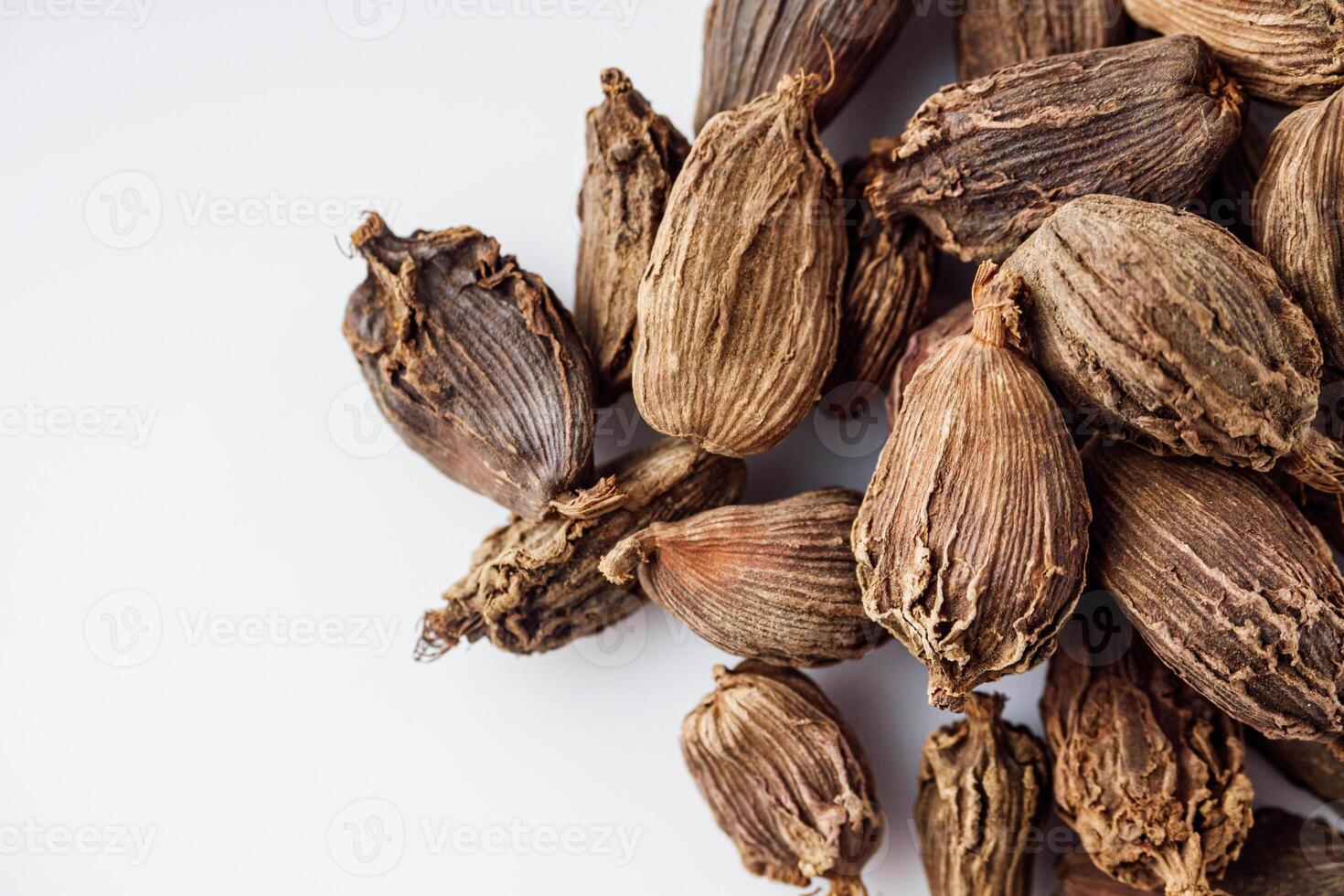 barrel dried black cardamom on a white background photo