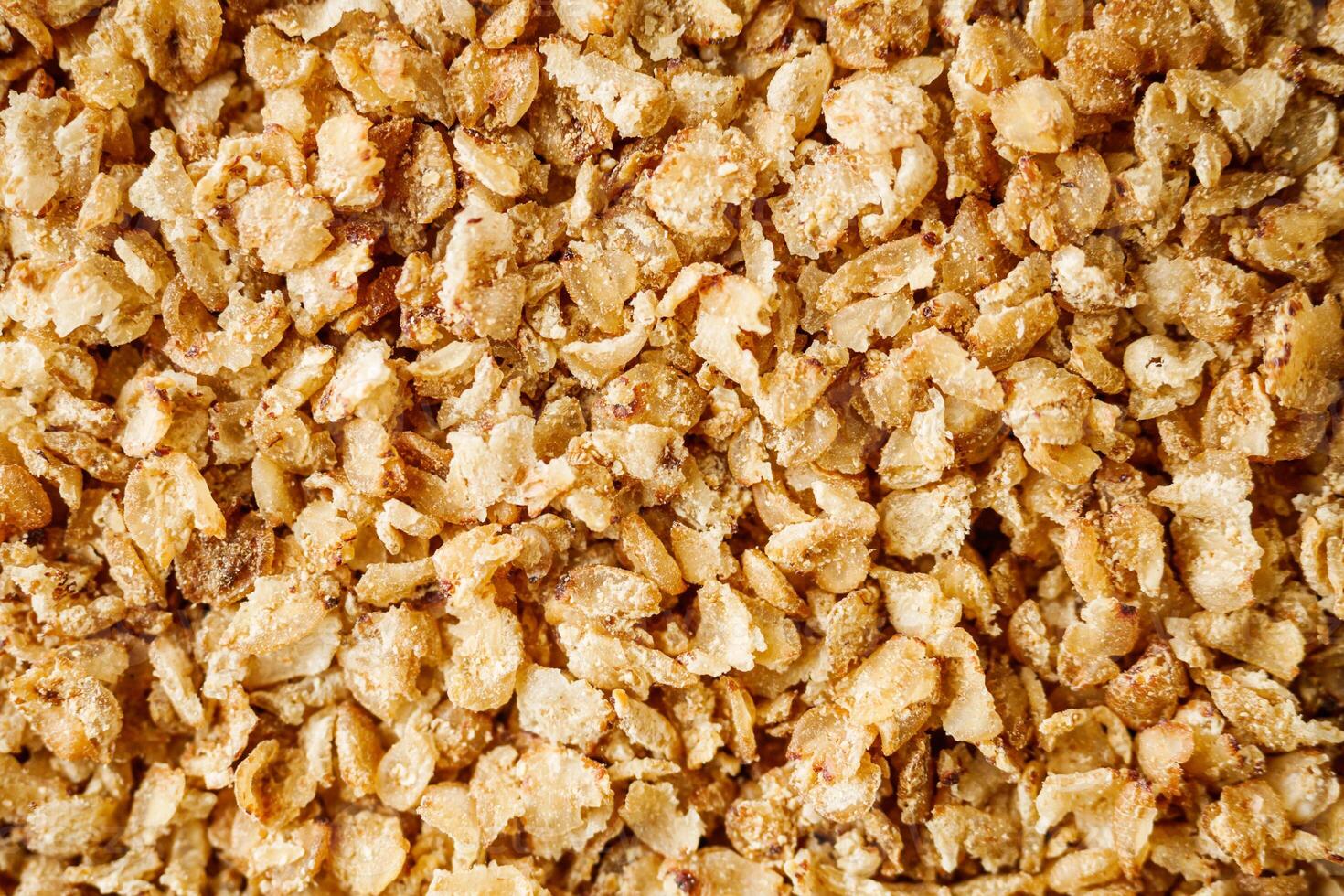 fresh raw buckwheat flakes on a black wooden background photo