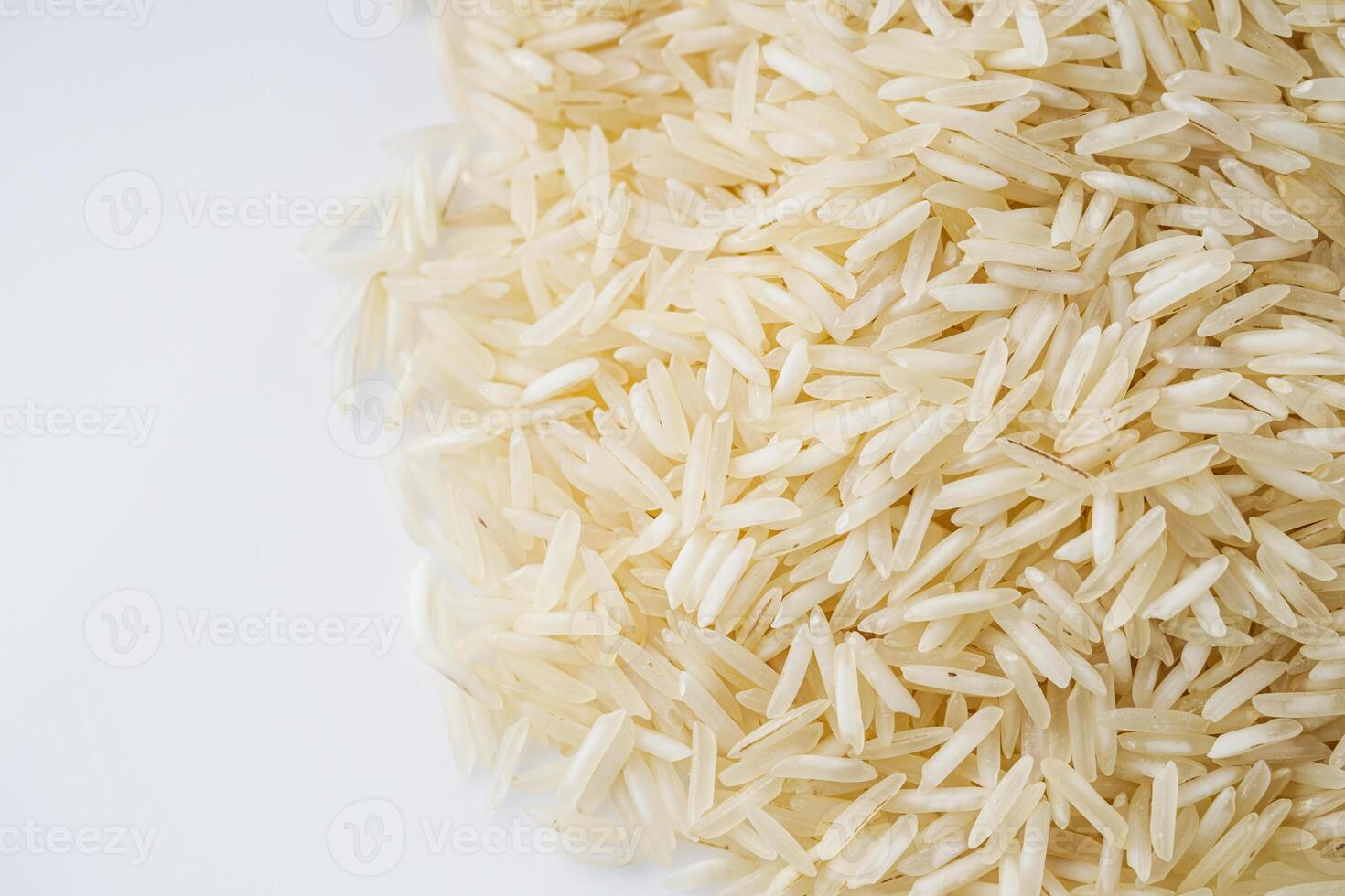 raw basmati rice on a white acrylic background photo