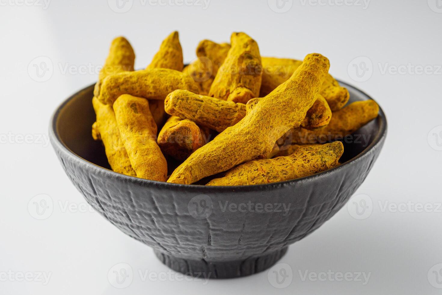 aromatic turmeric root on a white acrylic background photo