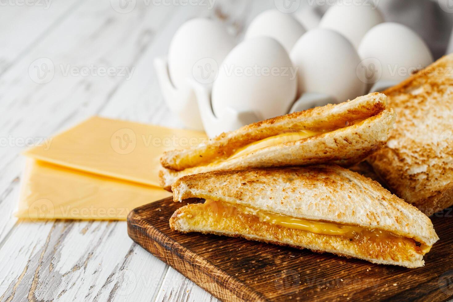 delicious cheese sandwich on a white rustic wooden background photo