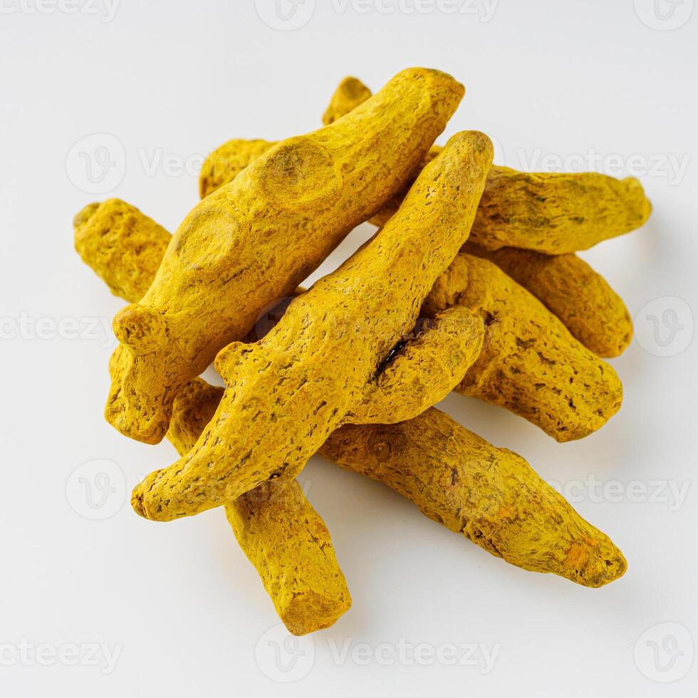 aromatic turmeric root on a white acrylic background photo