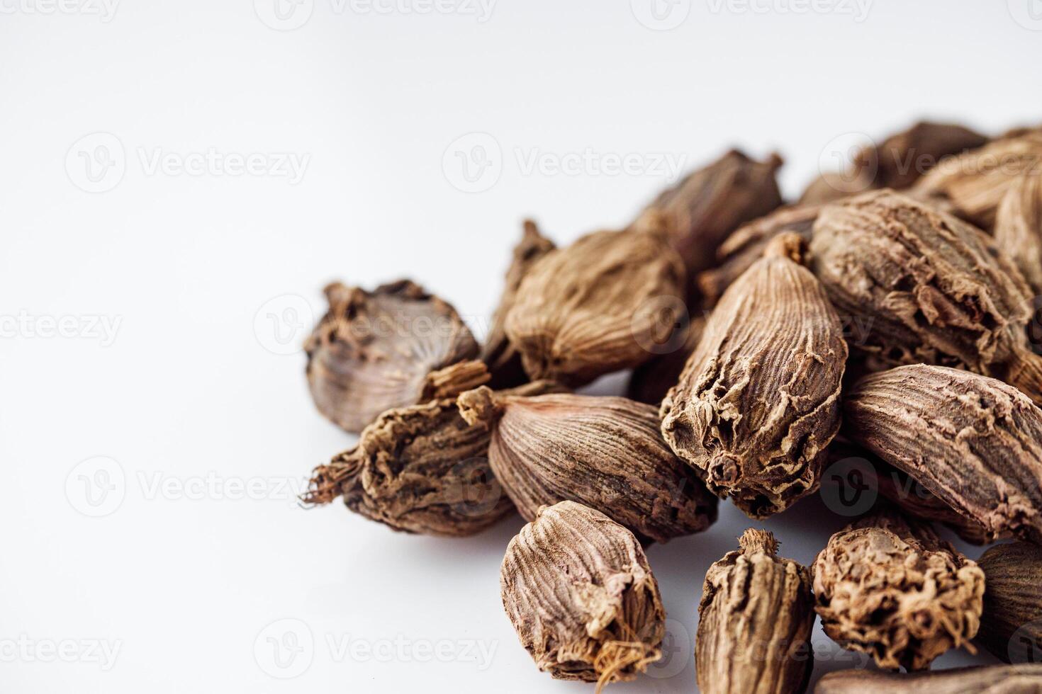 barrel dried black cardamom on a white background photo