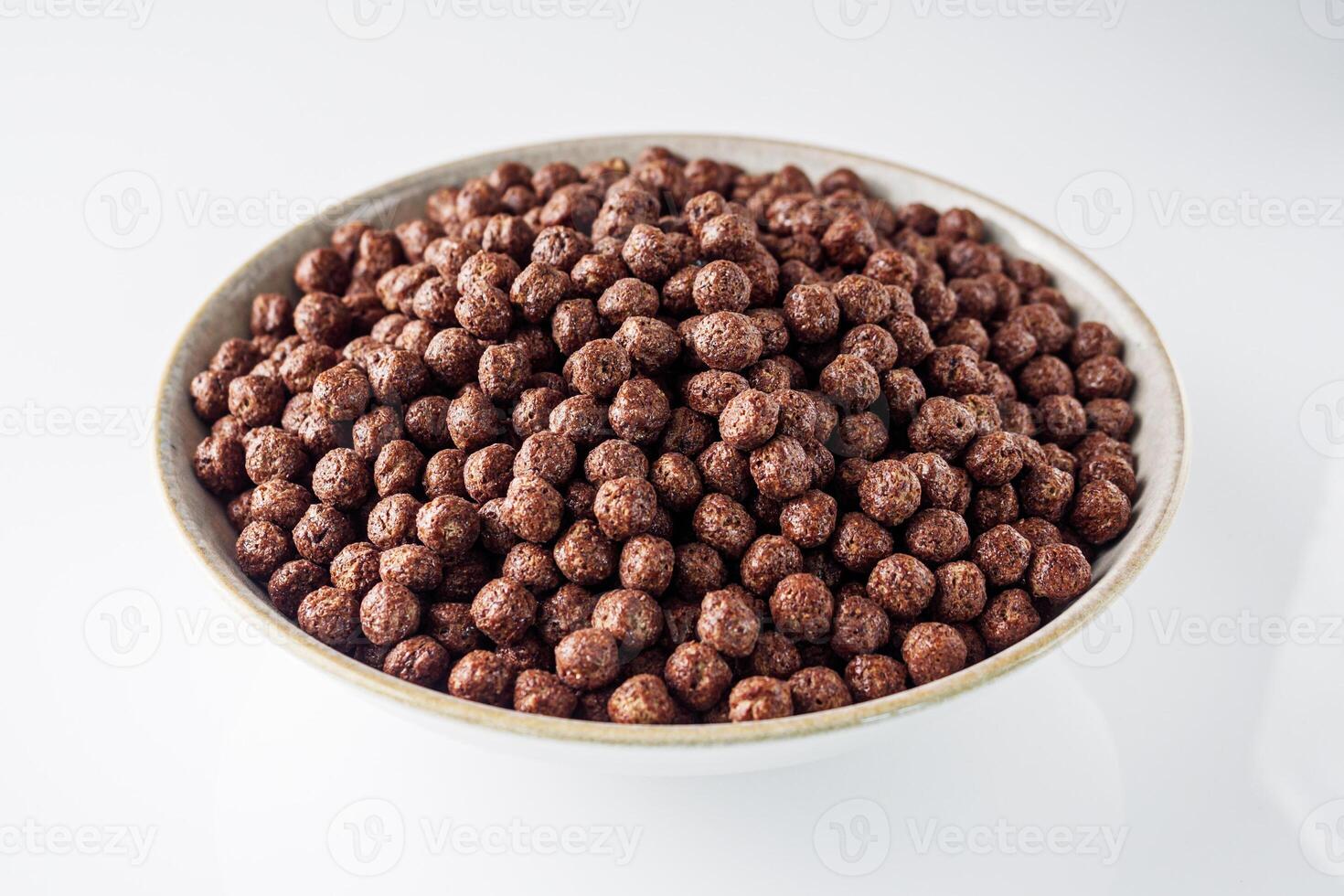 sweet crunchy chocolate children's breakfast chocolate balls on a white background photo