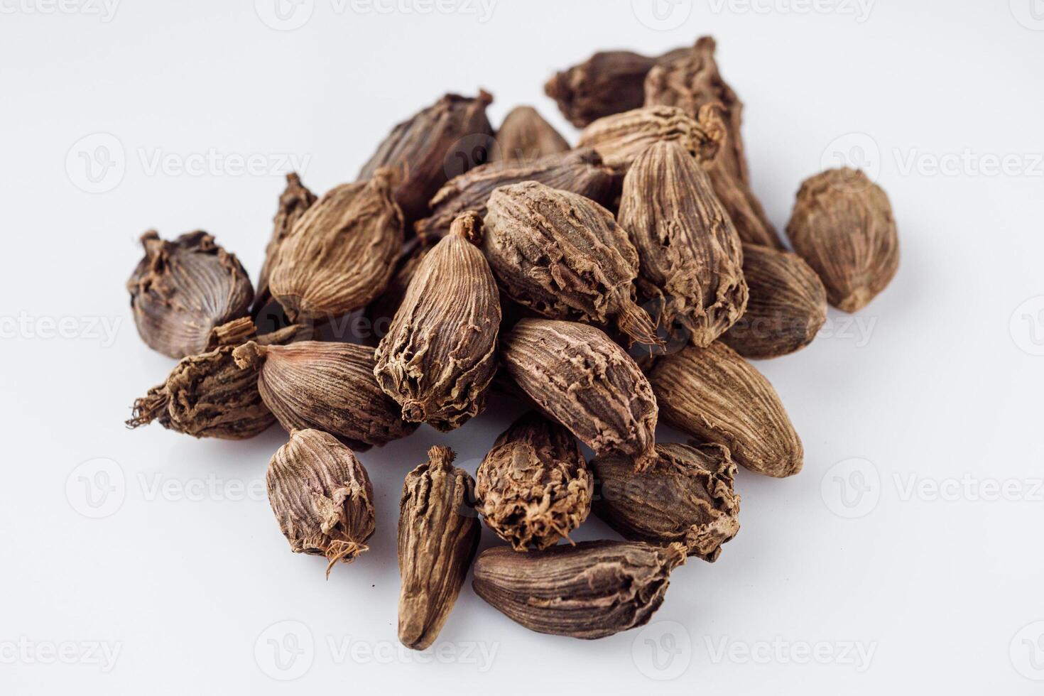 barrel dried black cardamom on a white background photo