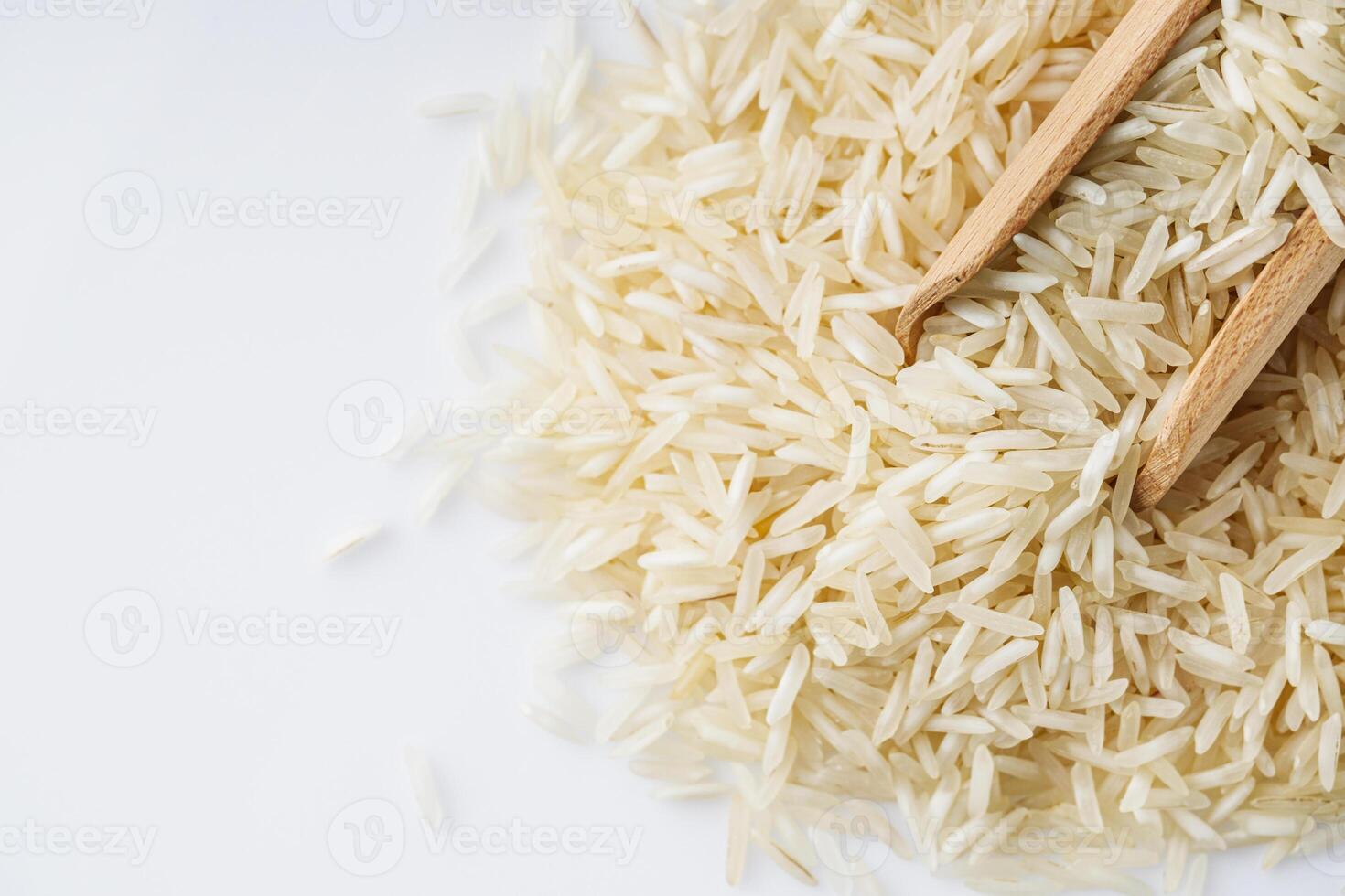 raw basmati rice on a white acrylic background photo