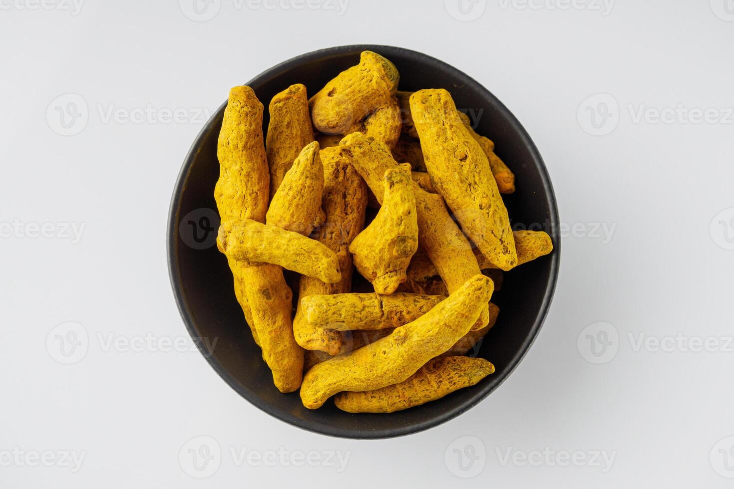 aromatic turmeric root on a white acrylic background photo