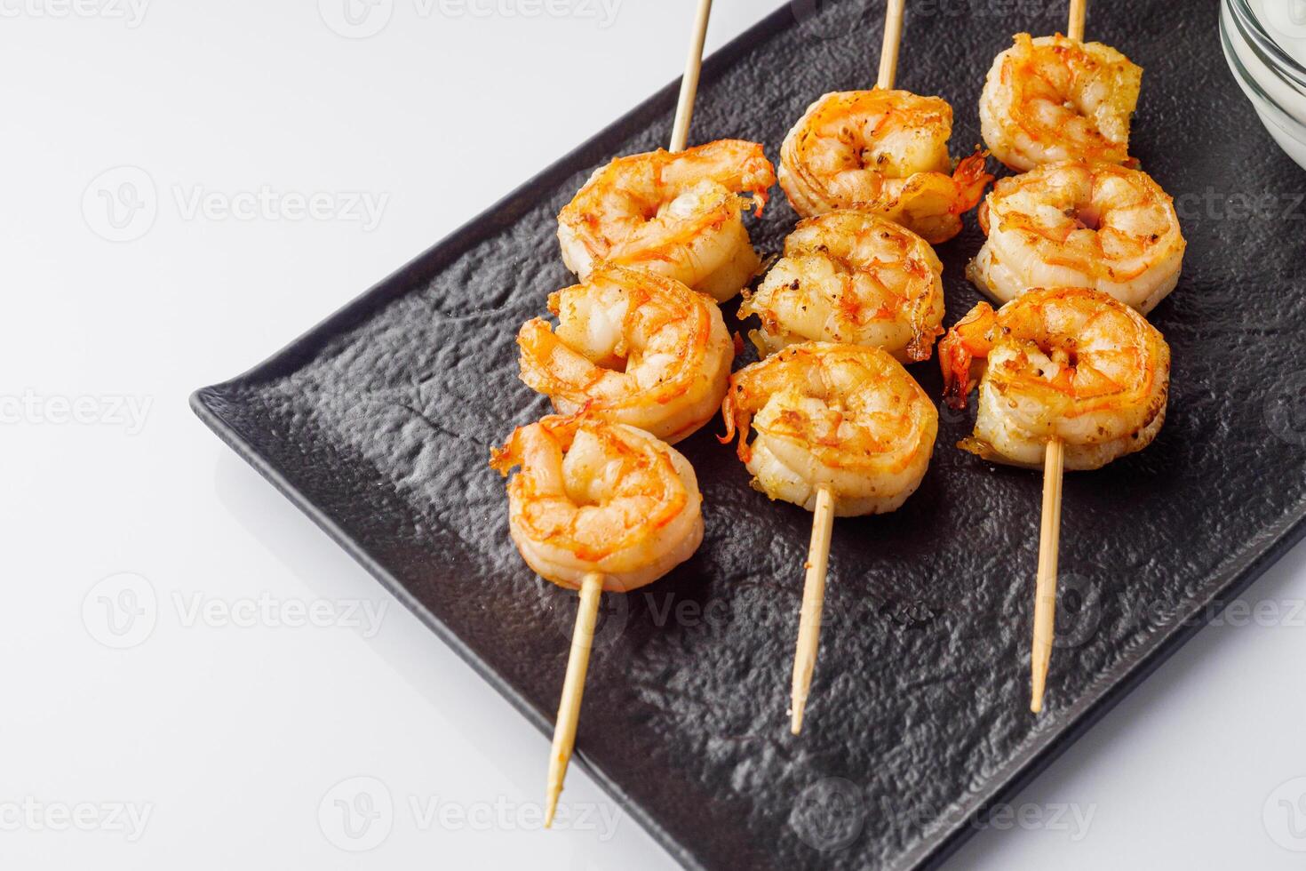 delicious grilled shrimp appetizer on a white background photo