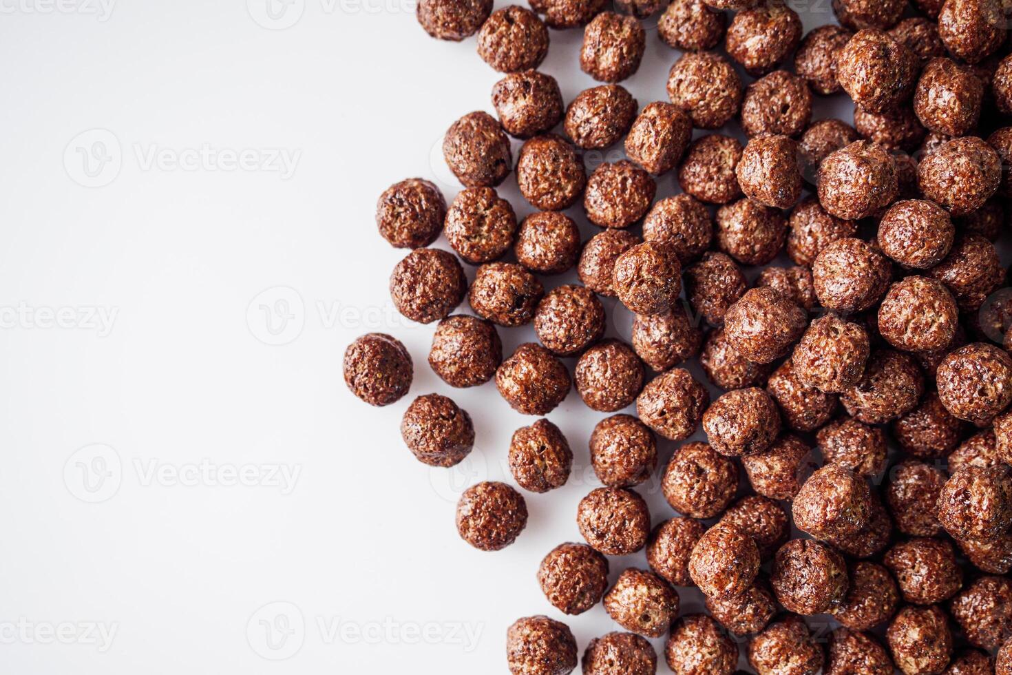 sweet crunchy chocolate children's breakfast chocolate balls on a white background photo