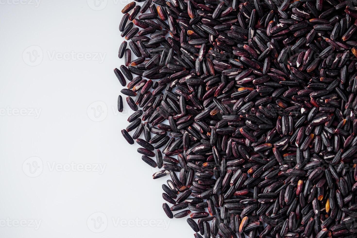 raw fresh black rice on a white background photo