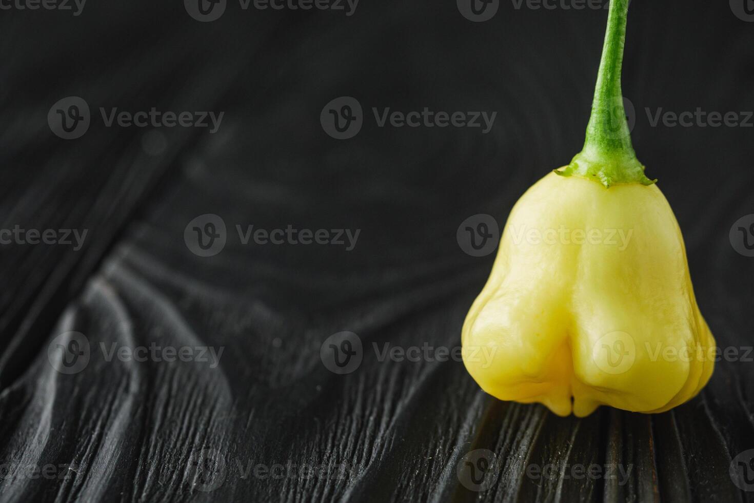 fresh delicious chili pepper aji white fantasy on a dark wooden rustic background photo