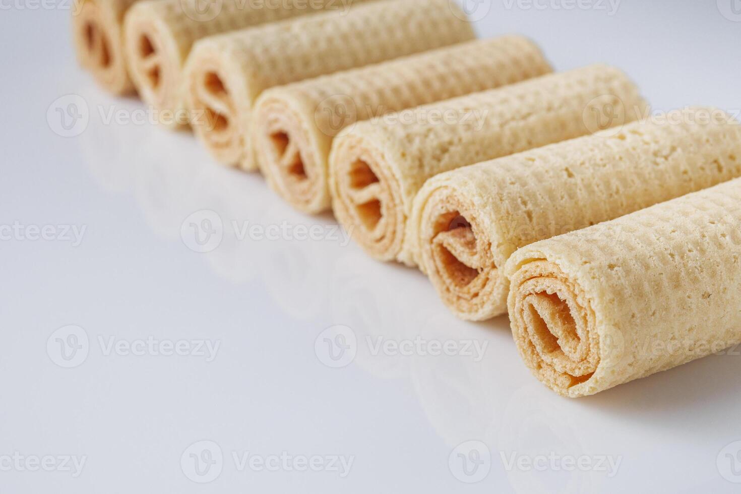 crispy dessert wafer rolls on a white background photo
