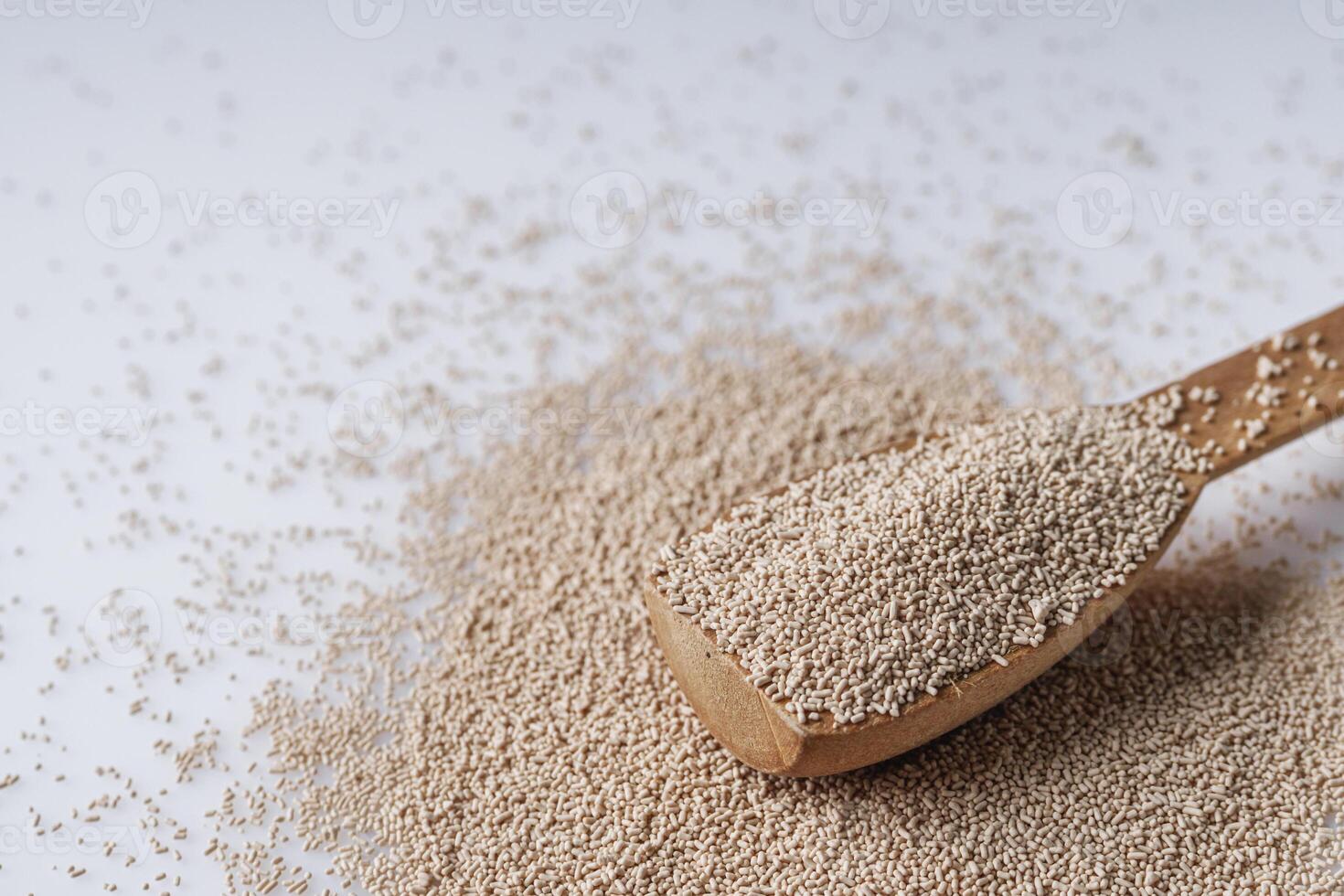 Granulated dry yeast on a white background photo