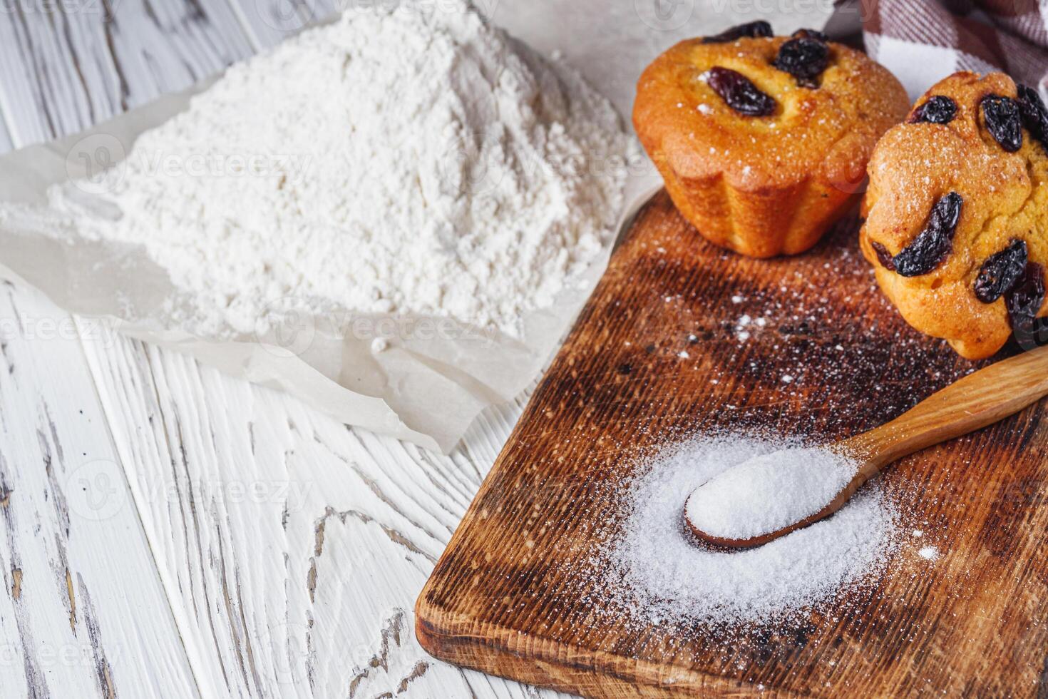 muffins baked with the addition of ammonium carbonate on a wooden rustic background photo