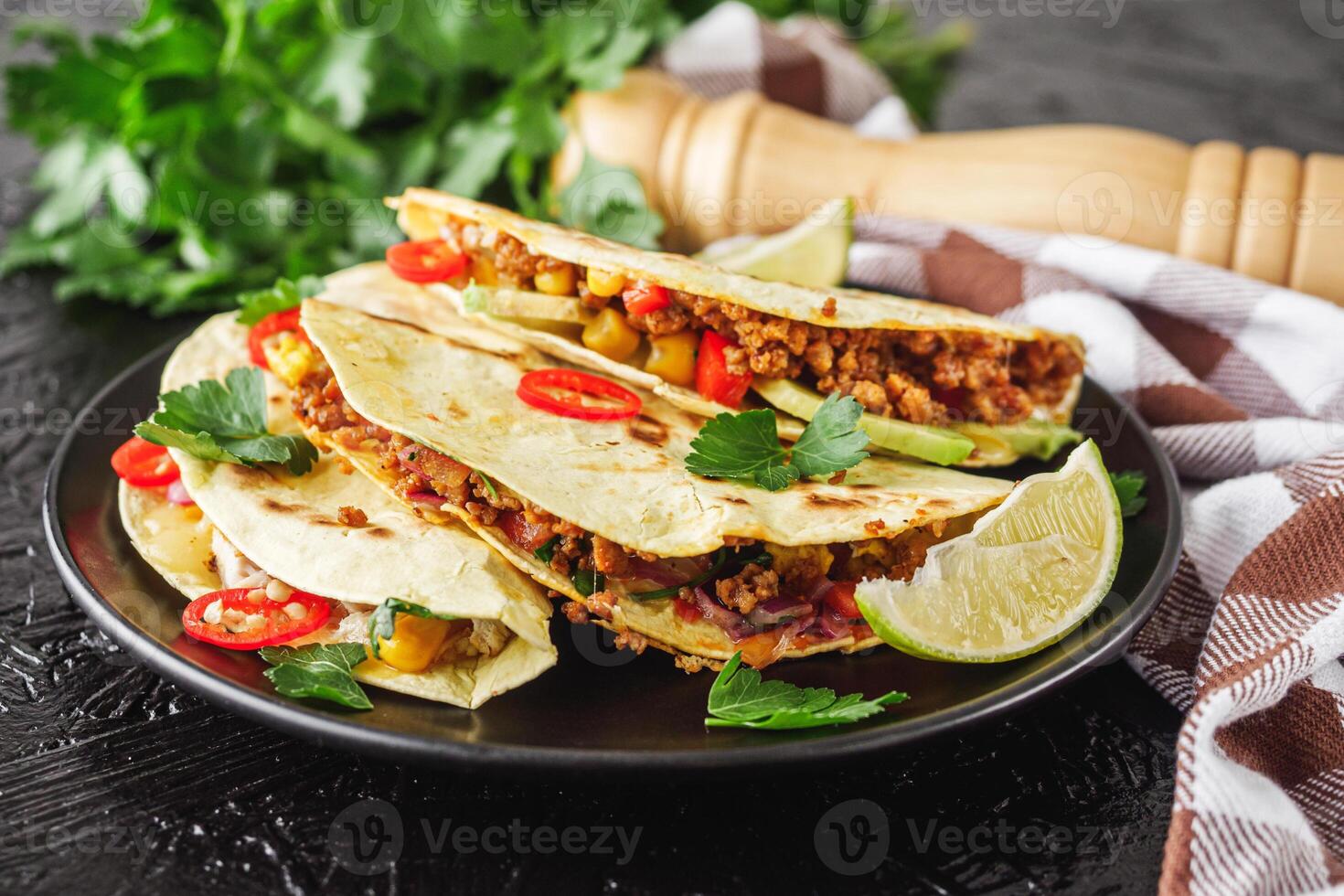 set of delicious fresh colorful quesadilla on a dark background photo