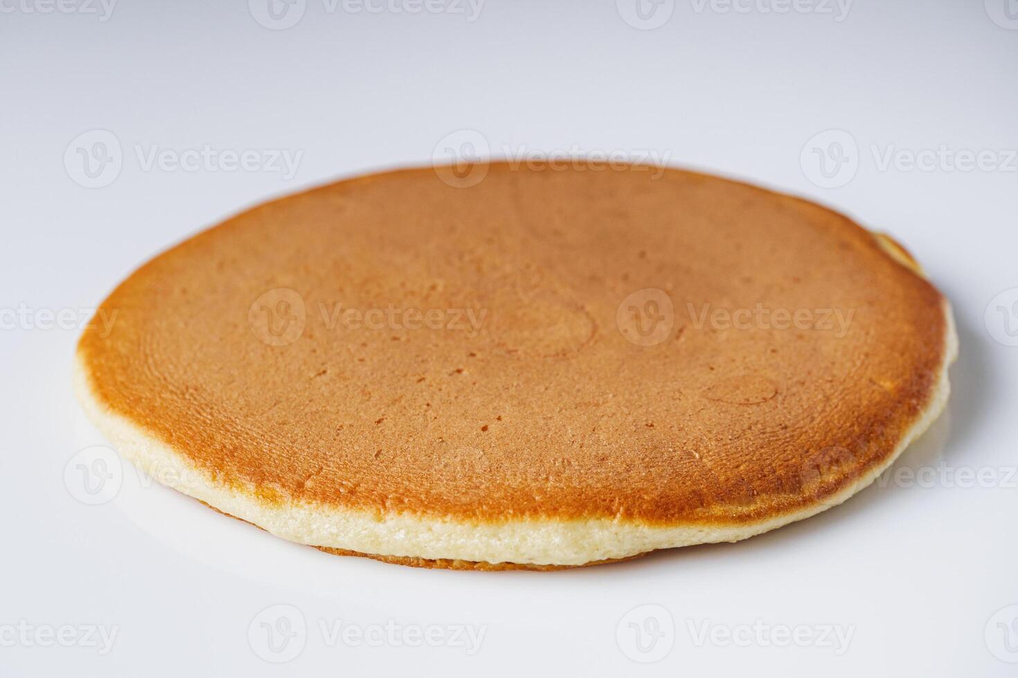 fresh tasty pancakes on a white background photo