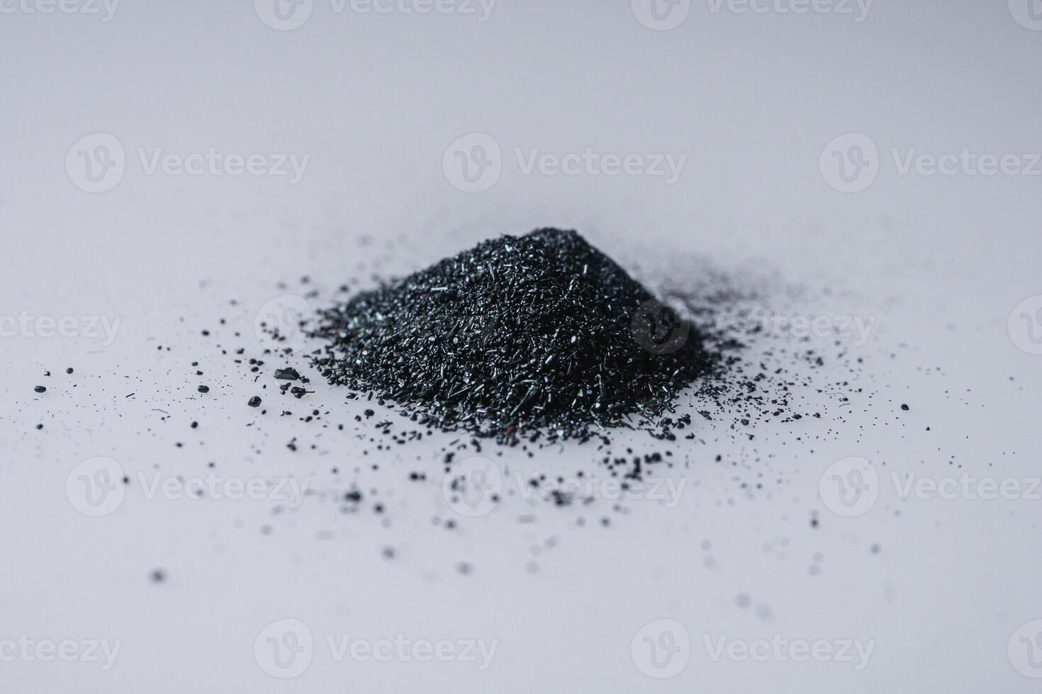 potassium permanganate crystals on a white background photo