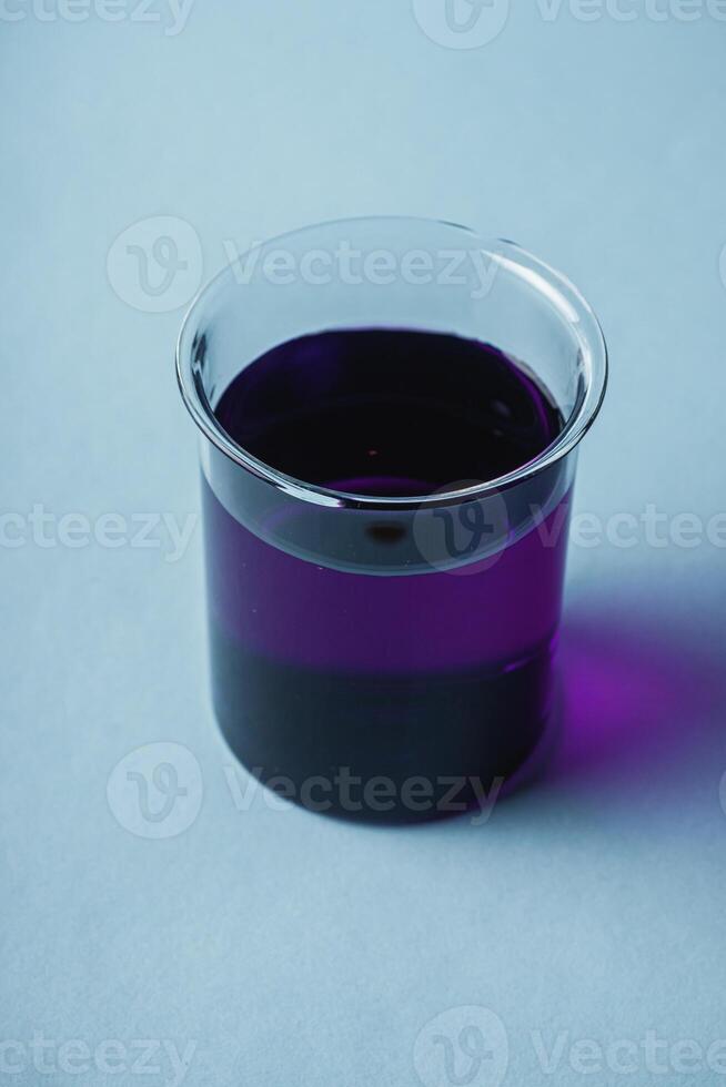 potassium permanganate solution on a blue background photo