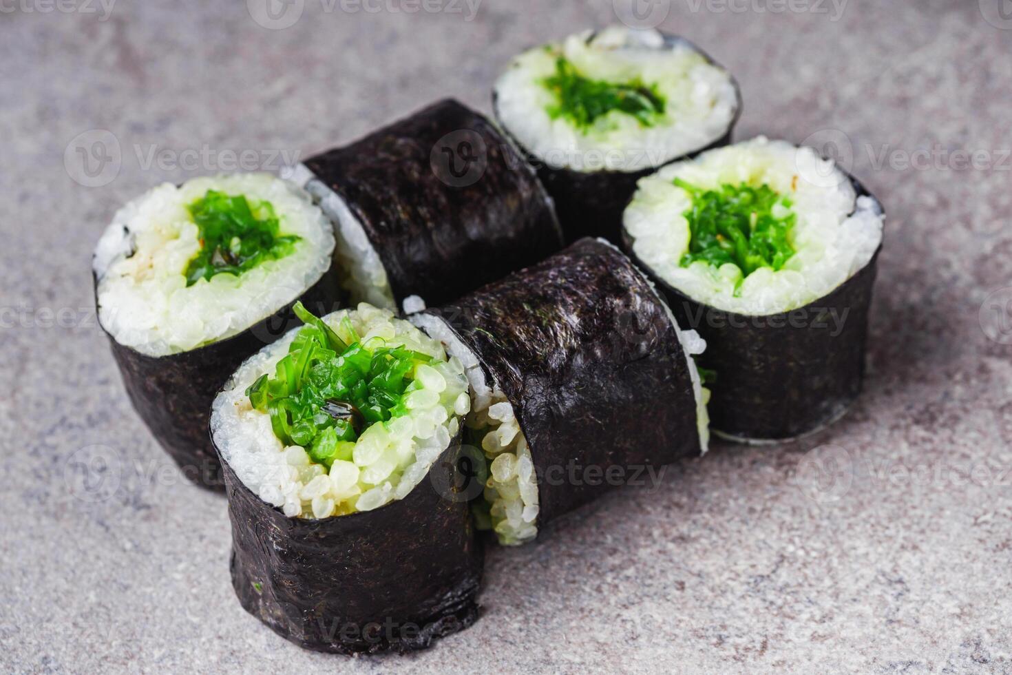 delicious fresh maki sushi roll with chuka salad photo