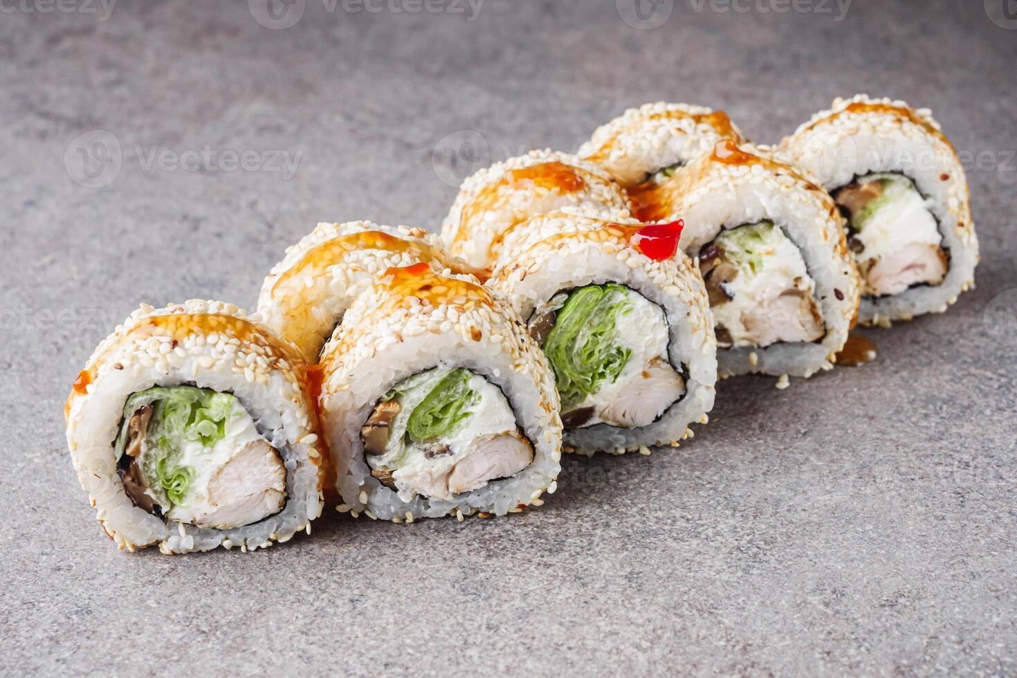 delicious fresh sushi roll philadelphia cheese with chicken cucumber and avocado photo