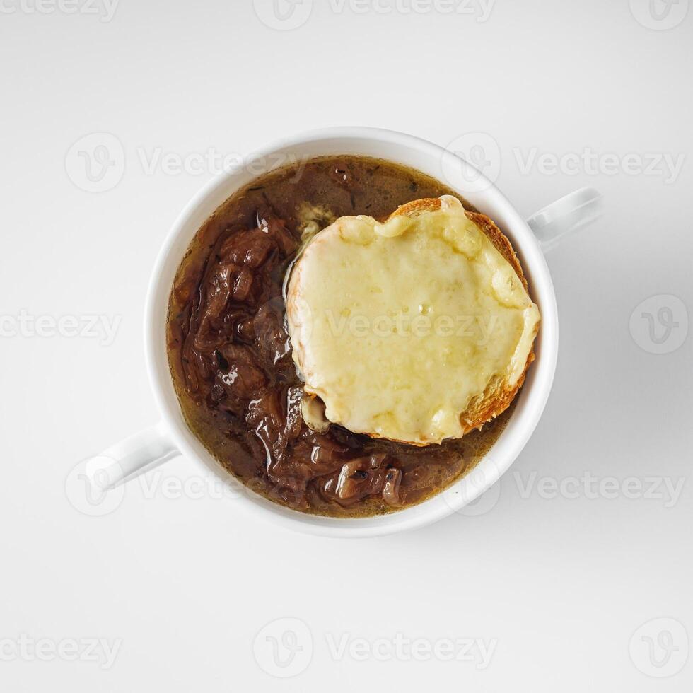 delicious original French onion soup on a white background photo