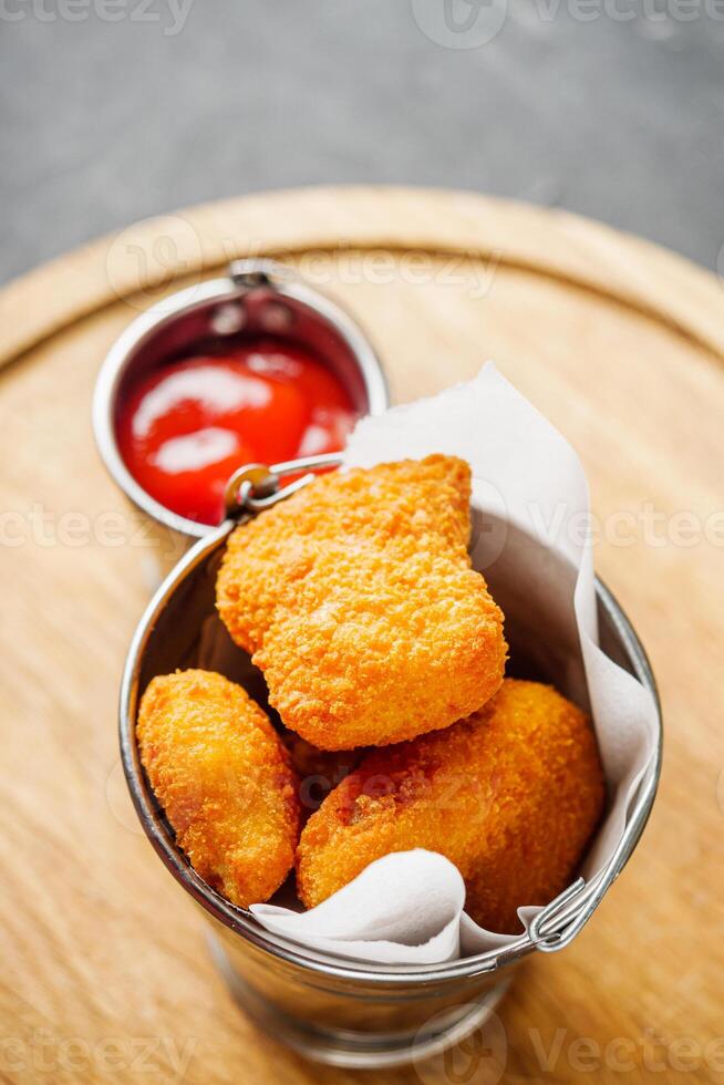 delicious hot fried nuggets in crispy breading photo