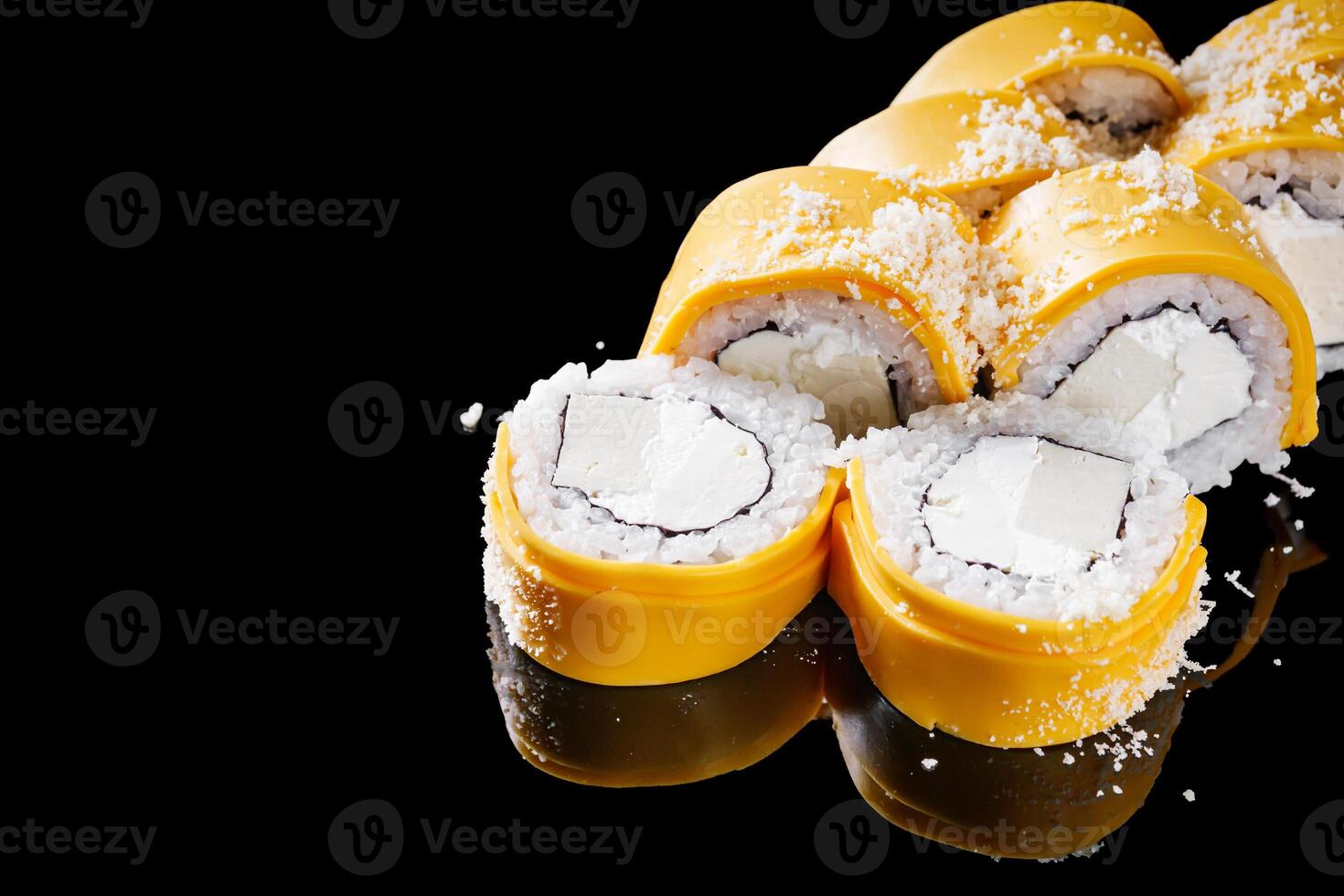 sushi roll with American cheese tofu and Philadelphia on a black mirror background photo