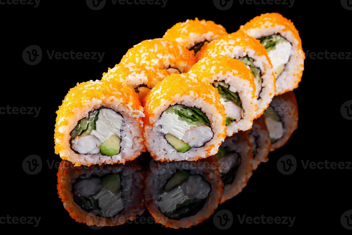 sushi roll with shrimp tobiko cucumber cream cheese avocado on a black mirror background photo