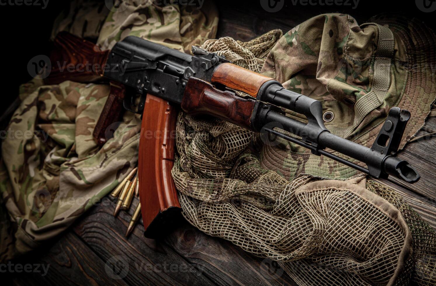 Classic Soviet AK machine gun on a wooden back. Weapons of Russia and the Soviet Union. photo