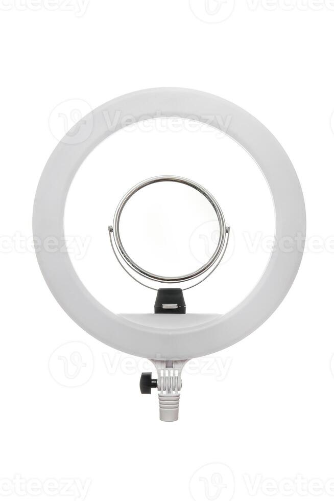 Closeup of circular neon LED lamp isolated white background. Popular modern light for make-up and beauty portraits. photo