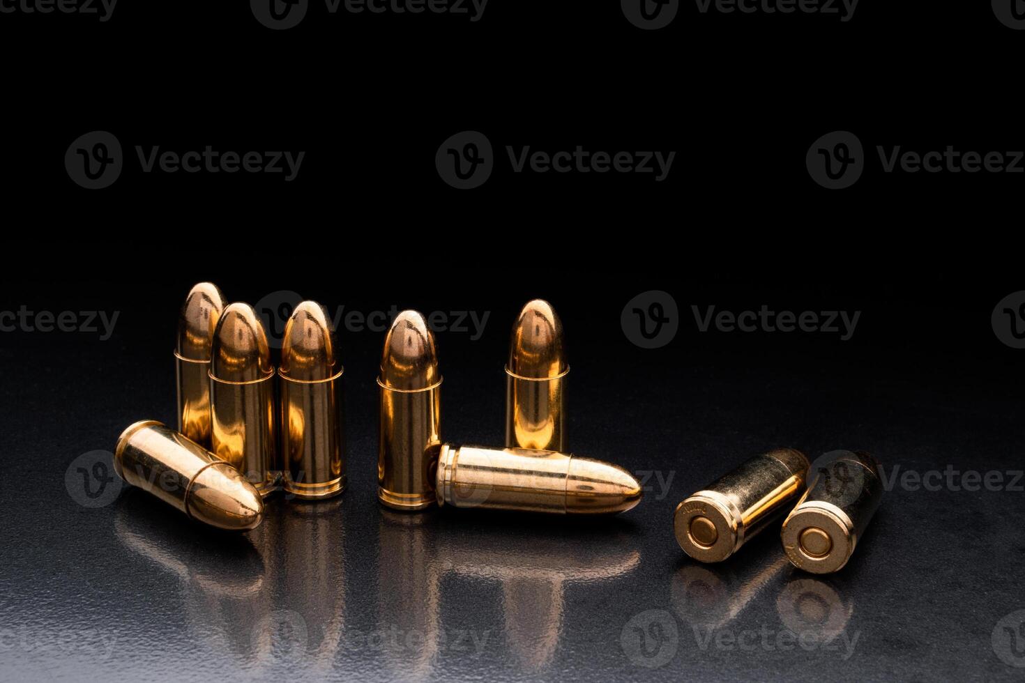 Bullet isolated on black background with reflexion. Rifle bullets close-up on black back. Cartridges for rifle and carbine on a black. photo