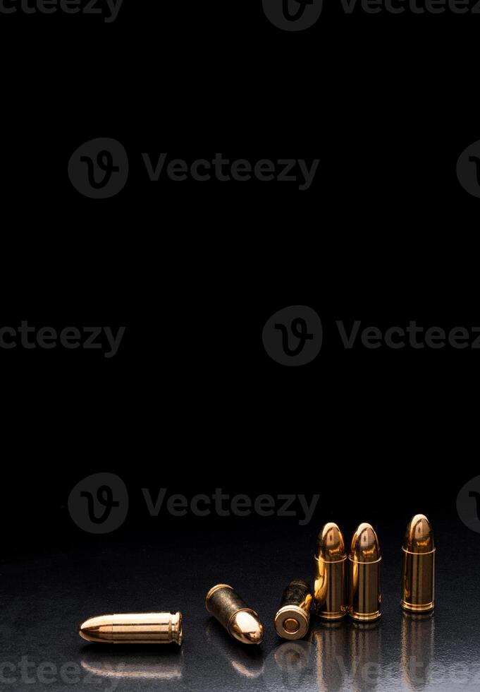 Bullet isolated on black background with reflexion. Rifle bullets close-up on black back. Cartridges for rifle and carbine on a black. photo